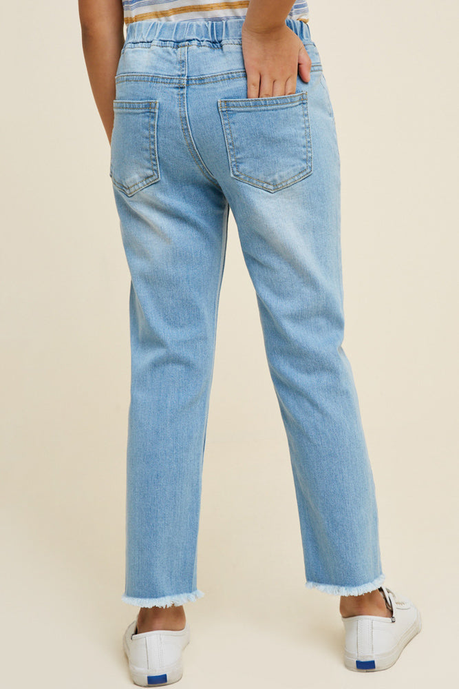 Teens light wash distressed denim jeans.