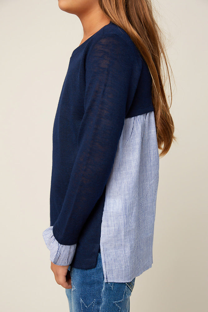 Navy, pinstripe back sweater paired with jeans.