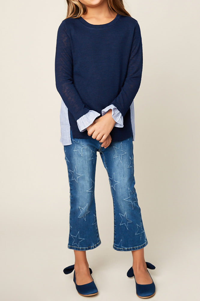 Navy, pinstripe back sweater paired with jeans.