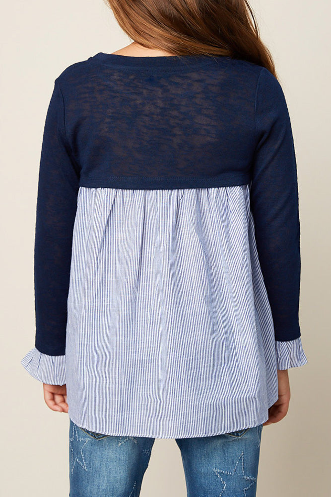 Navy, pinstripe back sweater paired with jeans. 