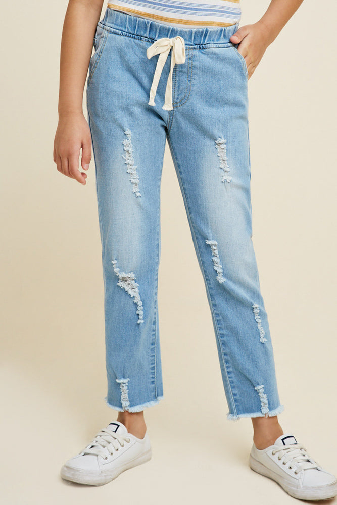 Teens light wash distressed denim jeans. 