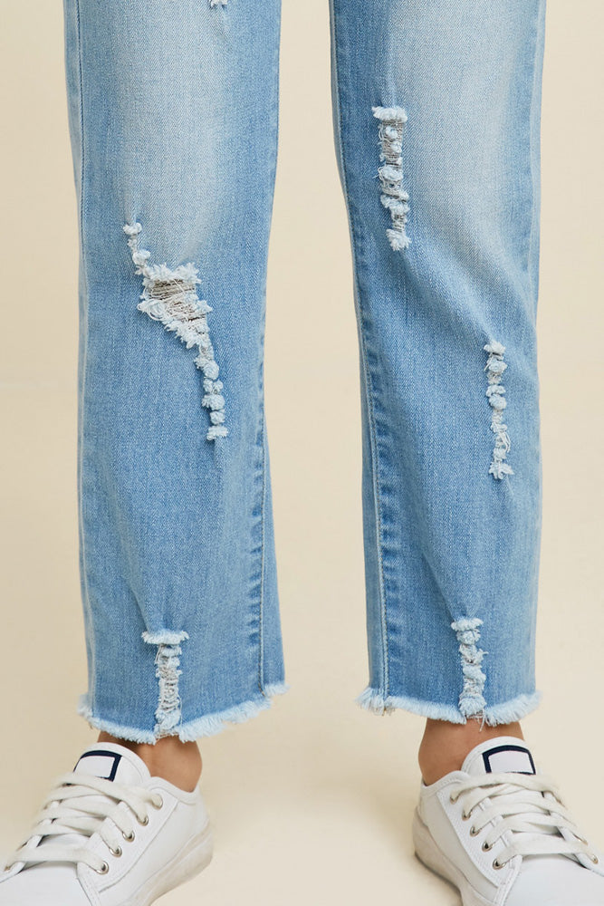 Light wash, distressed denim jeans. 